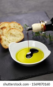 Pouring Balsamic Vinegar Into Olive Oil, Making Dipping Sauce