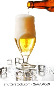 Pouring Beer From Bottle Into Glass Isolated On White