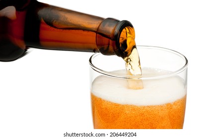 Pouring Beer From Bottle Isolated On White Background