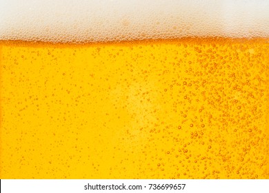 Pouring Beer With Bubble Froth In Glass For Background On Front View Wave Curve Shape Texture Foam ,  Drink Alcohol Celebration Party Holiday Happy New Year Concept