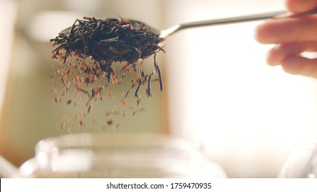 Pouring Black Tea In Slow Motion With Spoon.