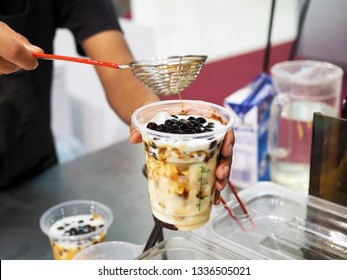 Pouring Brown Sugar Pearl (boba) Over Glass Of Iced Fresh Milk.Trendy Lifestyle Drink. 