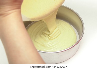 Pouring Cake Batter Into Cake Mold