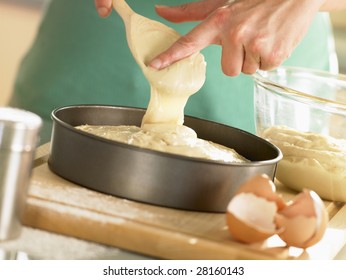 Pouring Cake Mixture Into Baking Tin