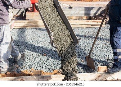 Pouring cement or concrete with a concrete mixer truck, construction site with a reinforced grillage foundation, start of construction of a production workshop - Shutterstock ID 2063346215