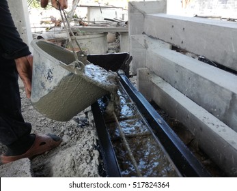Pouring cement during for construction - Shutterstock ID 517824364