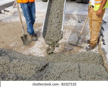 Pouring Cement On Newly Paved Road