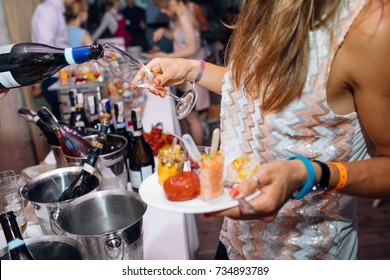 Pouring champagne into glass at hen-party, close up - Shutterstock ID 734893789