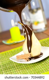 Pouring Chocolate On A Poached Pear