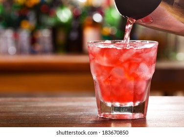Pouring Cocktail Into A Glass
