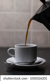 Pouring Coffee In A Cup , Using A Stovetop Coffee Maker