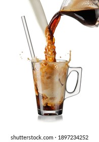 Pouring coffee and milk into a glass, making iced coffee concept