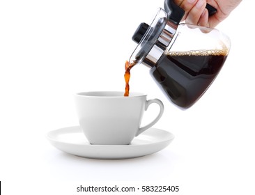 Pouring Coffee On A Cup Isolated On White Background