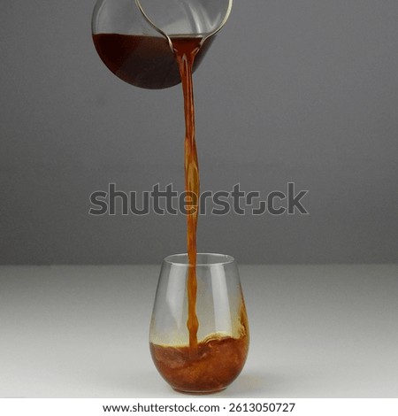 Pouring Coffee. Pouring Tea. Filter Coffee Into Glass. White Coffee Server. White background. square photo 