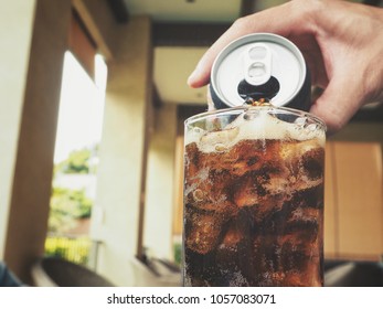 Pouring Cola Drink On Glass