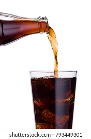 Pouring Cola Soda Drink From Bottle To Glass  With Ice Cubes On White Background