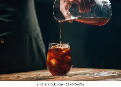 Pouring cold brew coffee - Shutterstock ID 1176656242