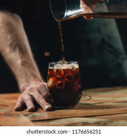 Pouring cold brew coffee - Shutterstock ID 1176656251