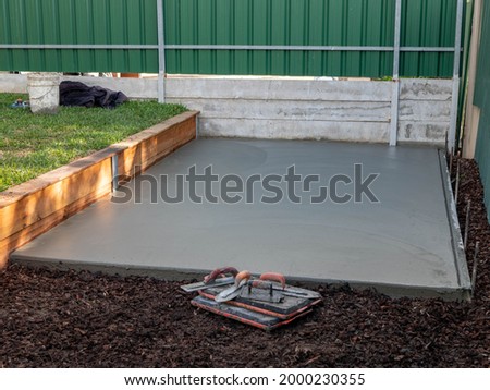 Pouring concrete slab for shed foundation in backyard ストックフォト © 