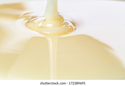 Pouring condensed milk close up view - Shutterstock ID 172389695
