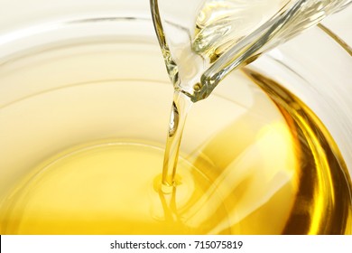 Pouring Cooking Oil Into Glass Bowl, Closeup