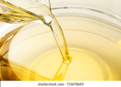 Pouring Cooking Oil Into Glass Bowl, Closeup