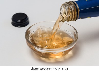 Pouring Cooking Sherry Into An Ingredient Bowl