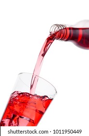 Pouring Cranberry Red Juice From Bottle To Glass  On White Background