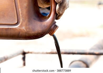 Pouring Crude Oil From Sample Canned.