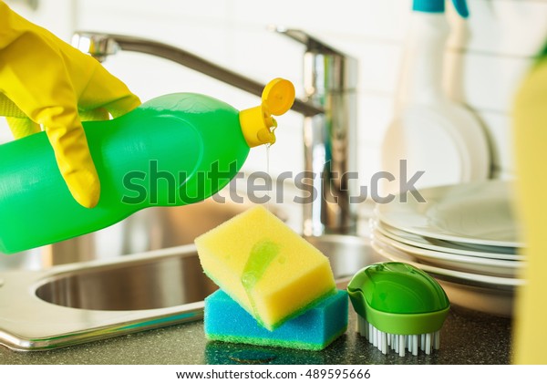pouring dishwashing liquid on sponge kitchen
wash cleaning