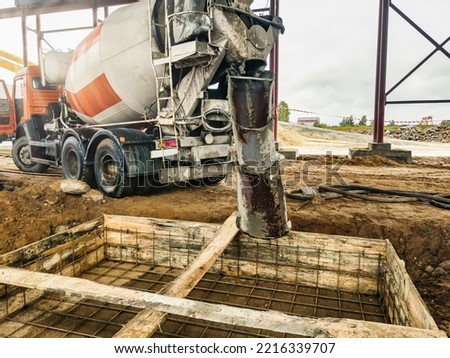 Pouring the foundation with concrete at the construction site. Monolithic reinforced concrete works during the construction of the building
