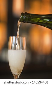 Pouring French Champagne Into Glass Flute