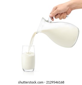 Pouring fresh milk into the glass isolated on white background. - Powered by Shutterstock