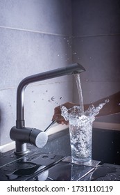  Pouring A Glass Of Fresh Water From A Kitchen Faucet