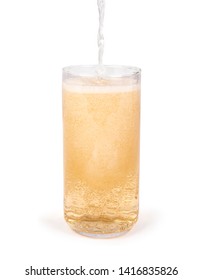 Pouring A Glass Of Ginger Ale Soda Isolated On White Background