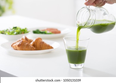 Pouring Green Juice Continuous Image