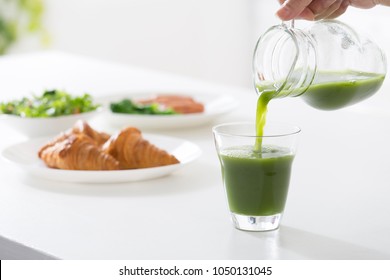 Pouring Green Juice Continuous Image