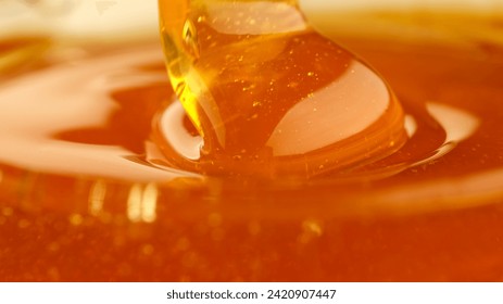 Pouring honey, flowing liquid sugar syrup. Thick Honey Dripping close up - Powered by Shutterstock