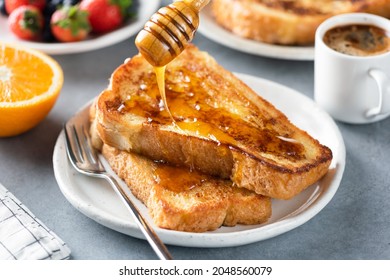 Pouring Honey On French Toast. Sweet Breakfast Food
