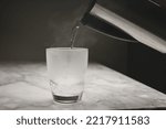 Pouring hot water at night