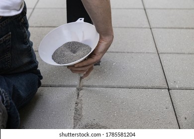 Pouring Jointing Sand In Paver Patio Installation