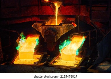 Pouring liquid copper metal for anodes into form in workshop - Shutterstock ID 2155478019