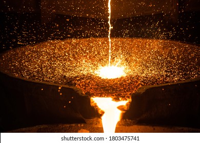 Pouring liquid metal from arc furnace - Shutterstock ID 1803475741