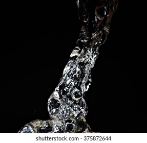 Pouring Liquid Spash Isolated On Black Background