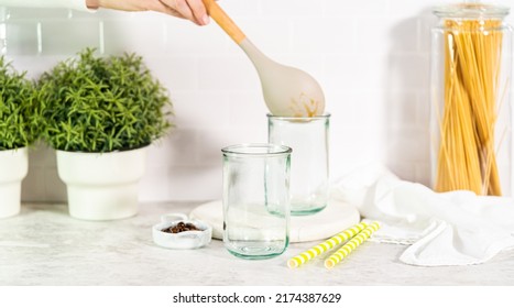 Pouring Mango Boba Smoothie Into The Drinking Glasses.