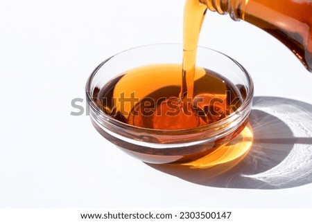 Pouring Maple Syrup in a Bowl