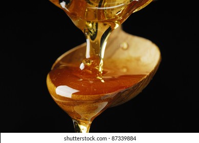 Pouring Maple Syrup over a Spoon