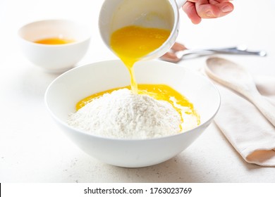 Pouring Melted Butter In Cake Dough