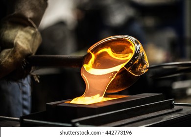 Pouring Melted Glass into Graphite Mold in Workshop - Powered by Shutterstock