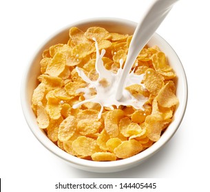 Pouring Milk Into Bowl Of Corn Flakes, Top View